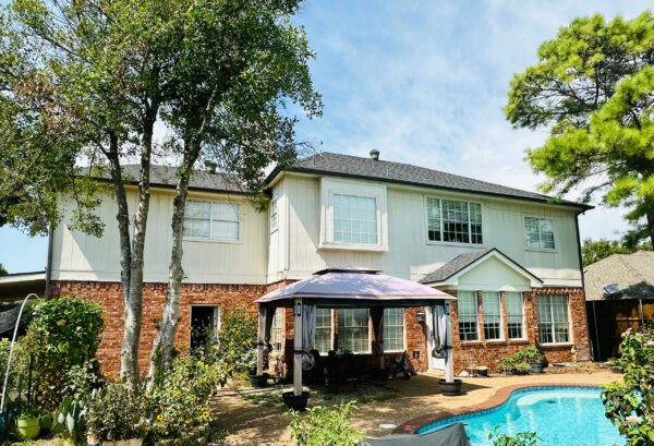 Full house renovation and shed siding replacement from old pressed wood to James Hardie Gray Slate planks and Arctic White Trims