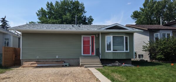 Removed vinyl siding and install 1” rigid foam Silverboard GPS insulation and Royal Sage Green vinyl siding