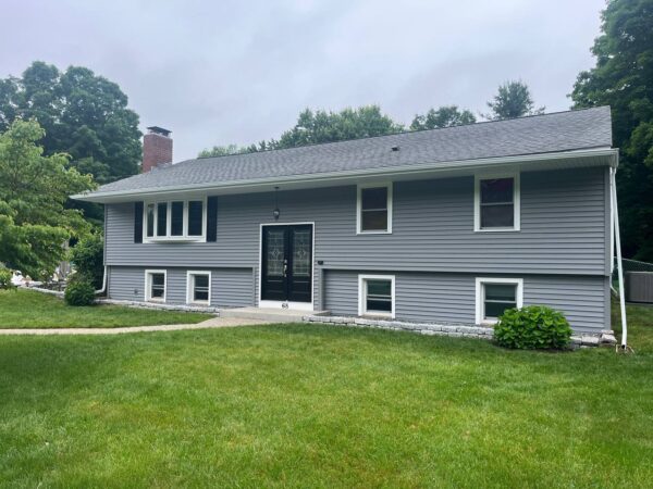 Vinyl house renovation featuring new siding materials