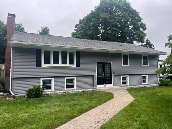 Vinyl house renovation featuring new siding materials