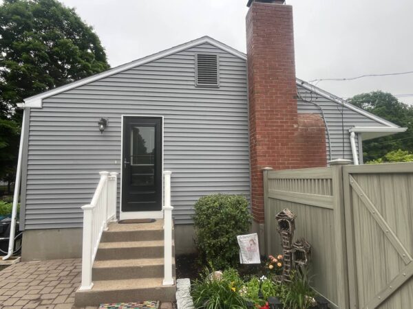 Vinyl house renovation featuring new siding materials