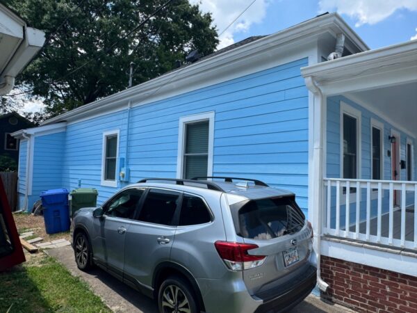 WOOD LAP SIDING REPLACED WITH JAMES HARDIE PRIMED 8.25
