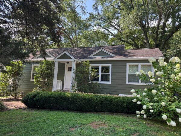 REPLACED SIDING WITH JAMES HARDIE C+ MOUNTAIN SAGE AND C+ ARCTIC WHITE TRIMS