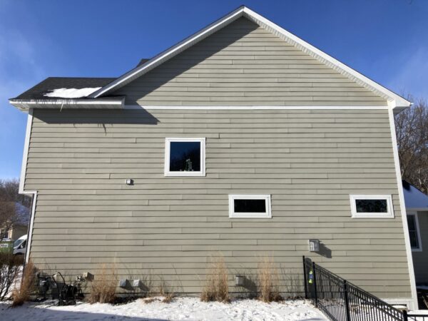 Resided 20 year old failing fiber cement wall (1,200 square feet) with James Hardie Plank siding (with 7” reveal) Cedarmill in Monterey Taupe color.