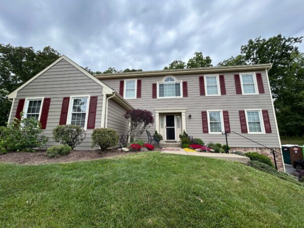 Wood T1-11 to Everlast Lap Siding in Antique Ivory (Trim) and Misty Taupe (Siding).