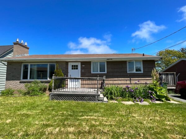 Home exterior renovation with new vinyl red siding