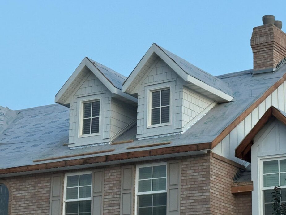 James Hardie Cedarmill Lap, Board and Batten, and Straight Shingle Siding in ColorPlus finish with Arctic White trims and corners