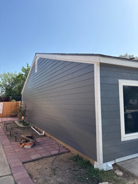 Installed James Hardie Cedarmill lap siding with matching primed trims and corners on designated exterior areas.